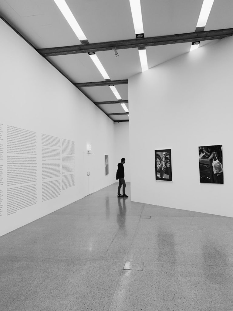 woman-walking-on-hallway-in-grayscale-photography-5nji3kb4mkc